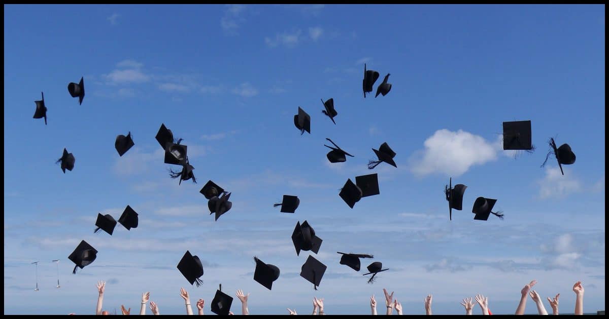 Graduation Caps Flying