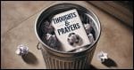 A greeting card with the phrase 'Thoughts & Prayers' written in clear, bold letters on the front. The card is discarded in a metallic garbage can.